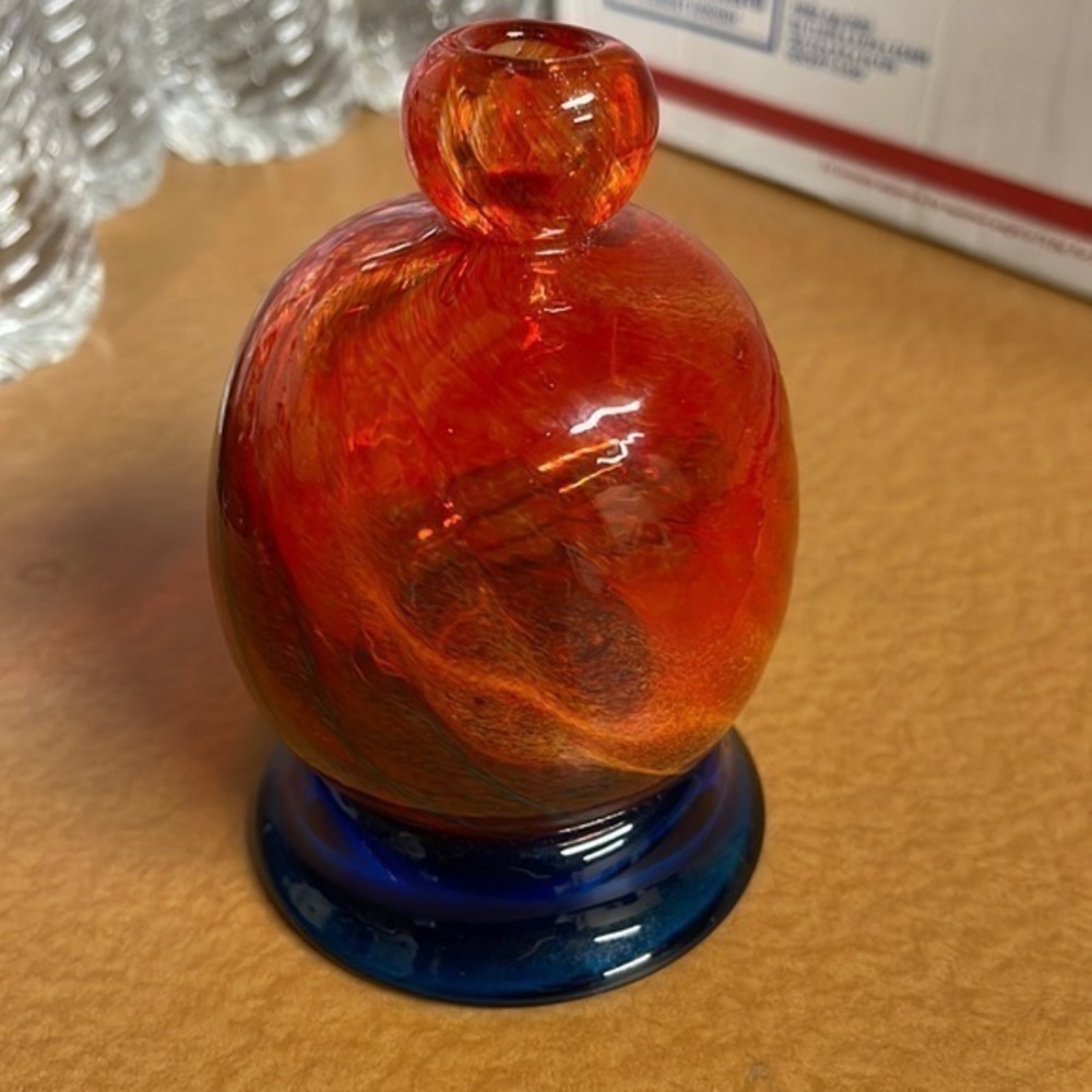 Decorative hand blown glass orange swirl vase
